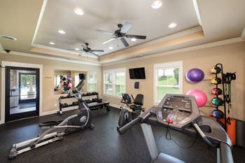 24-Hour club inspired fitness center including cardiovascular and weight equipment